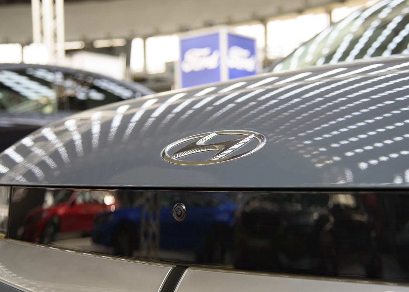 Close-up of Hyundai hood emblem and front camera