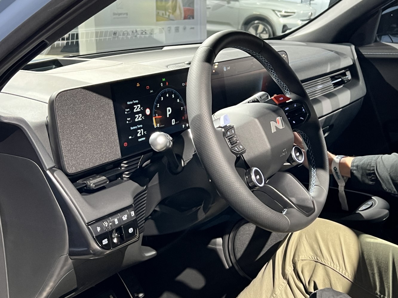 Electric vehicle interior with digital dashboard and advanced steering wheel controls