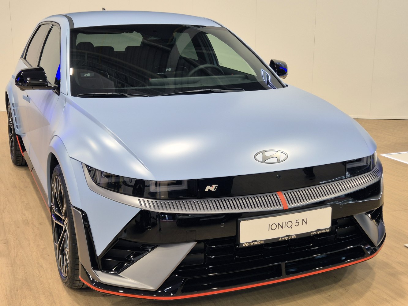 Modern LED headlights and front grill design of a 2022 model vehicle