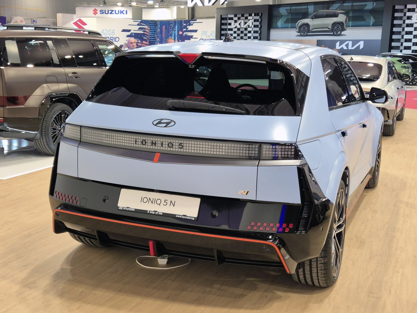 Rear view of electric hatchback with LED light bar and aerodynamic details