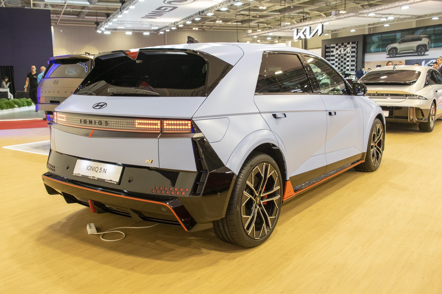 Futuristic rear design with LED tail lights and distinctive wheels.