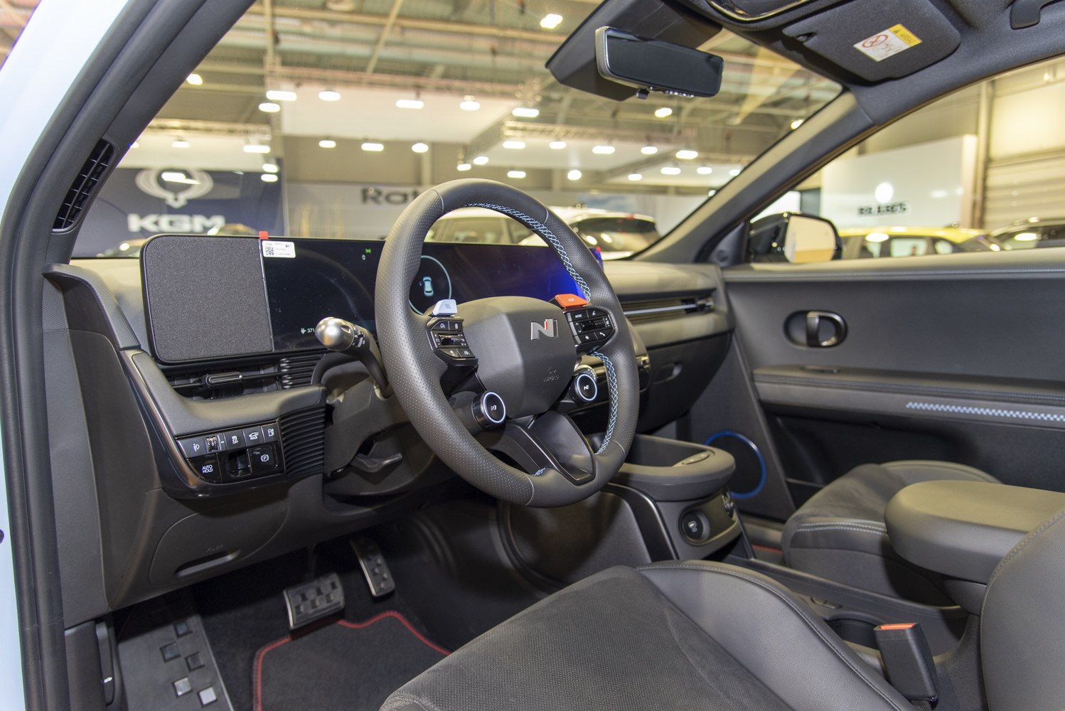 Modern electric vehicle steering wheel and dashboard with digital displays