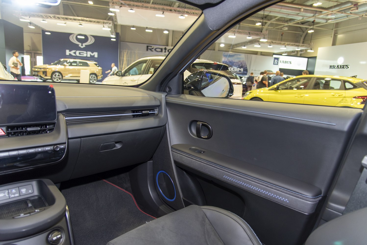 Minimalist dashboard and door panel with digital display and speaker