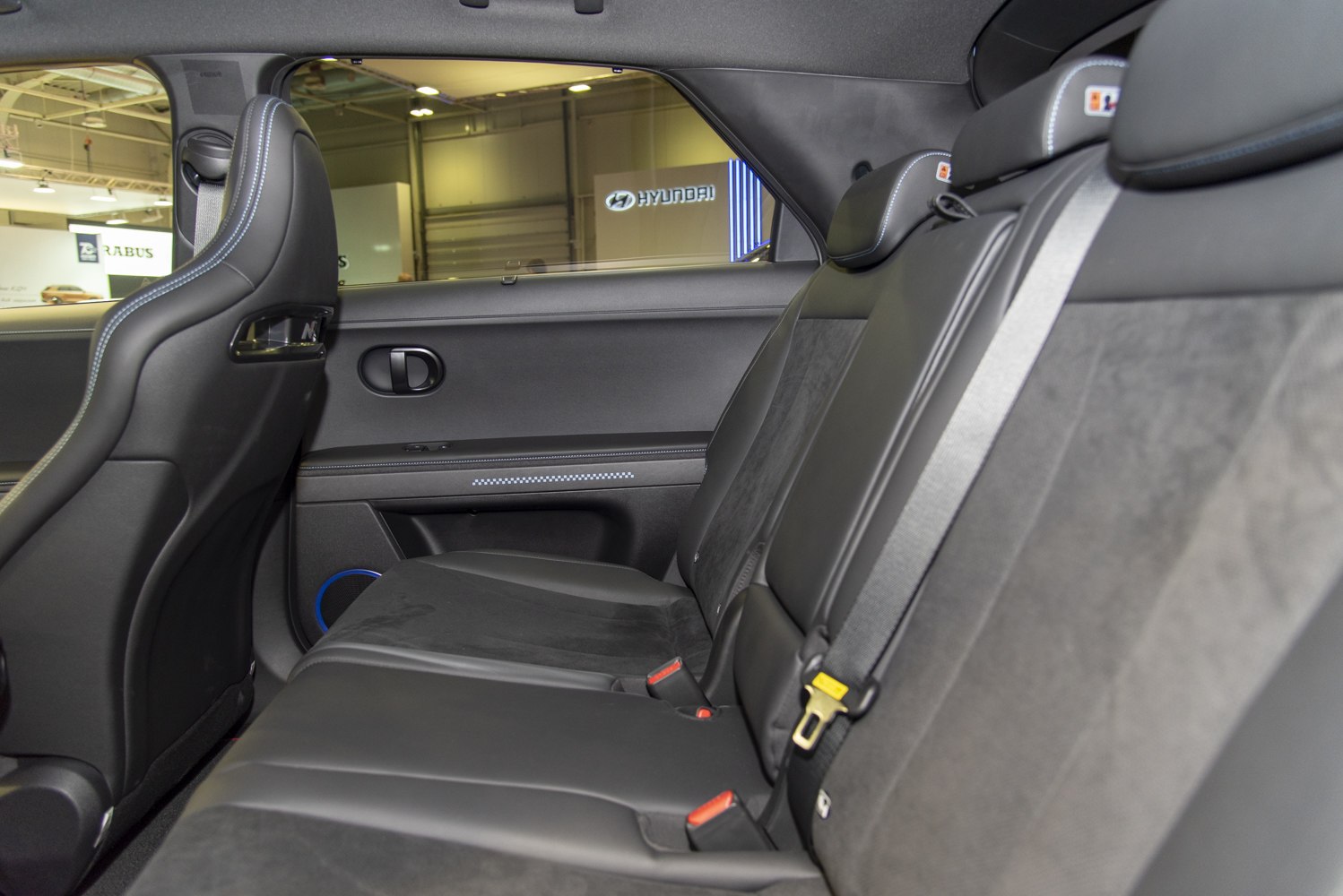 Rear seats with leather and suede upholstery and safety belts