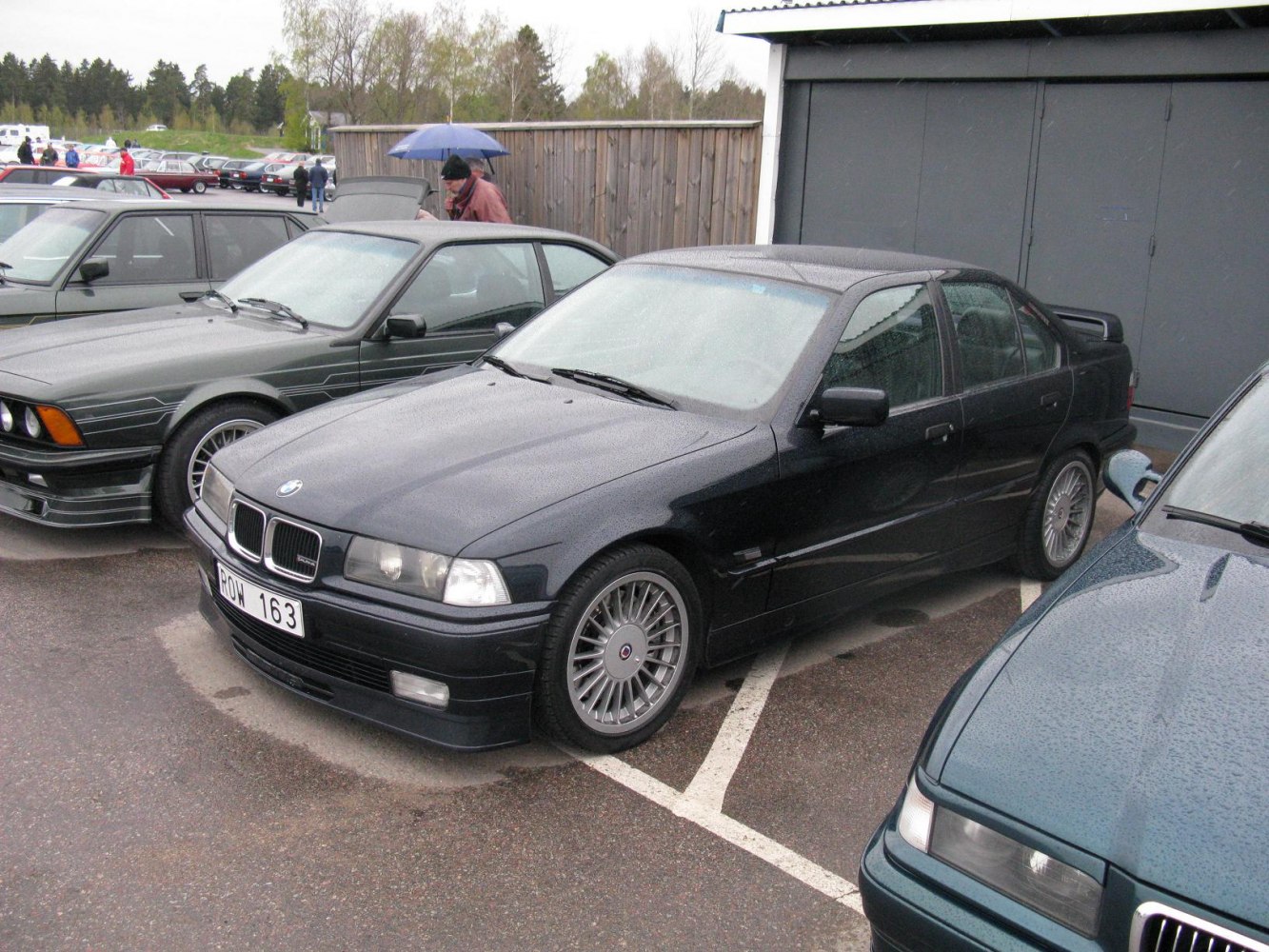 Sedan with distinct multi-spoke wheels and rear spoiler