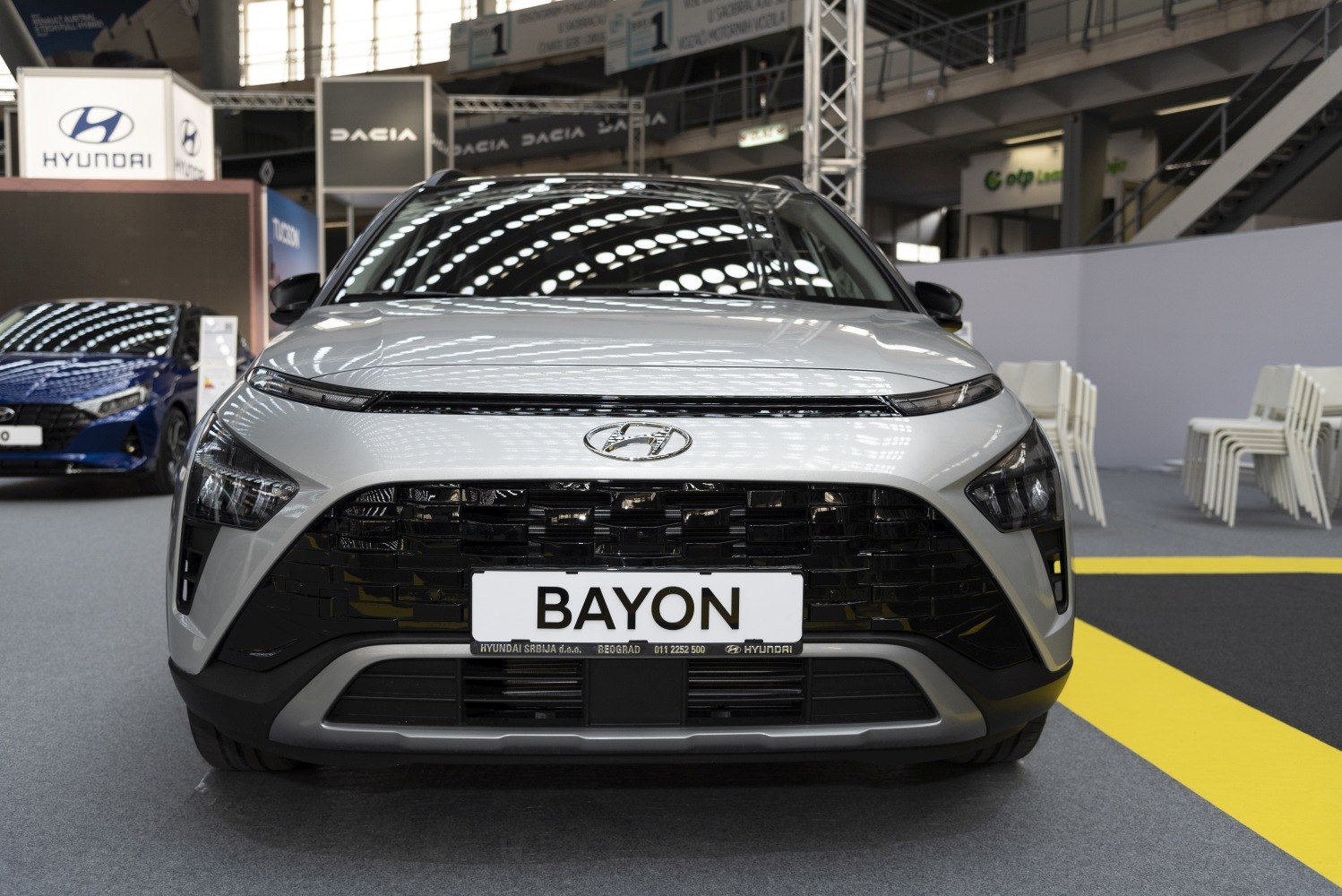 Close-up of front LED headlights and black grille