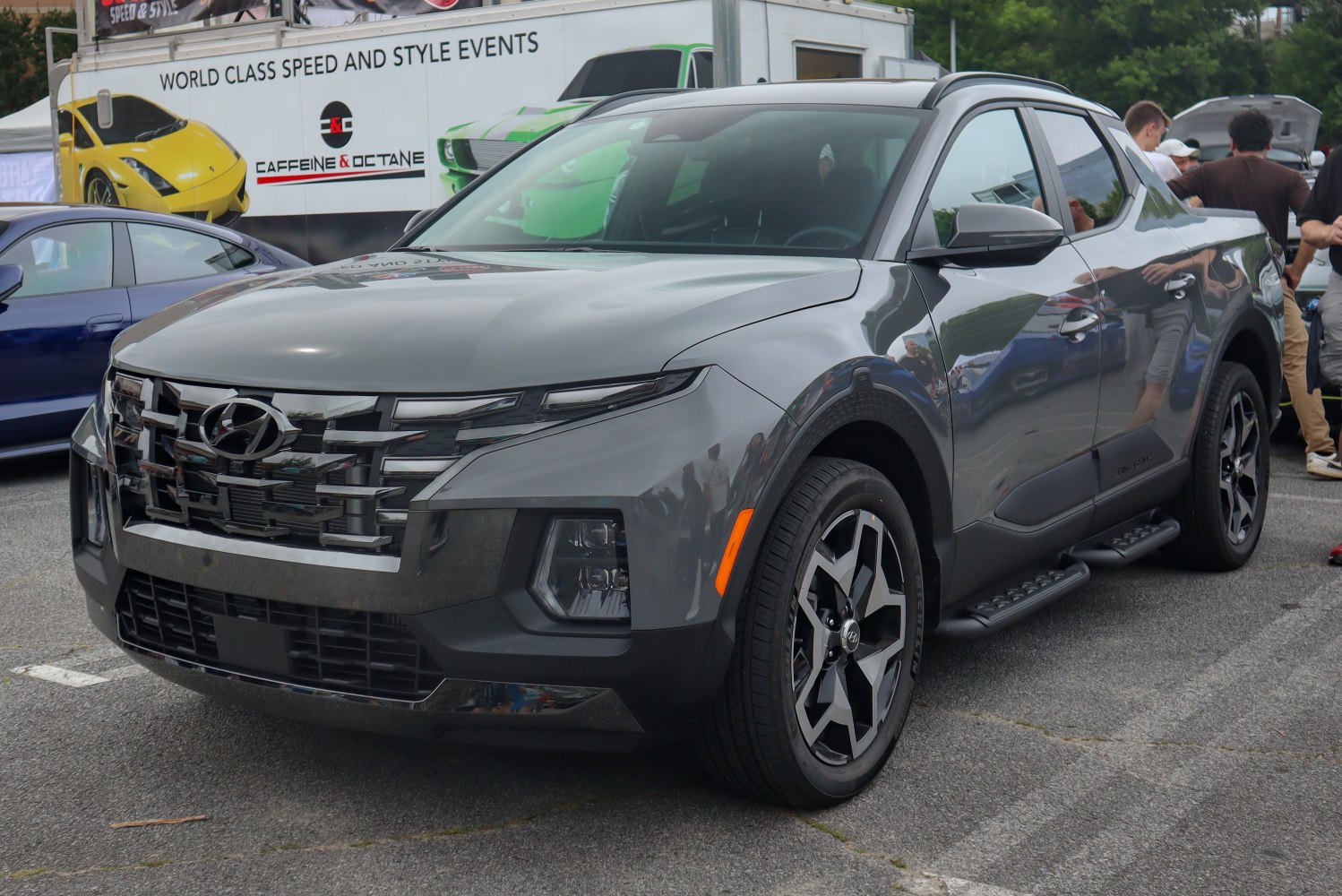 Front angled view with distinctive grille, headlights, and modern wheels