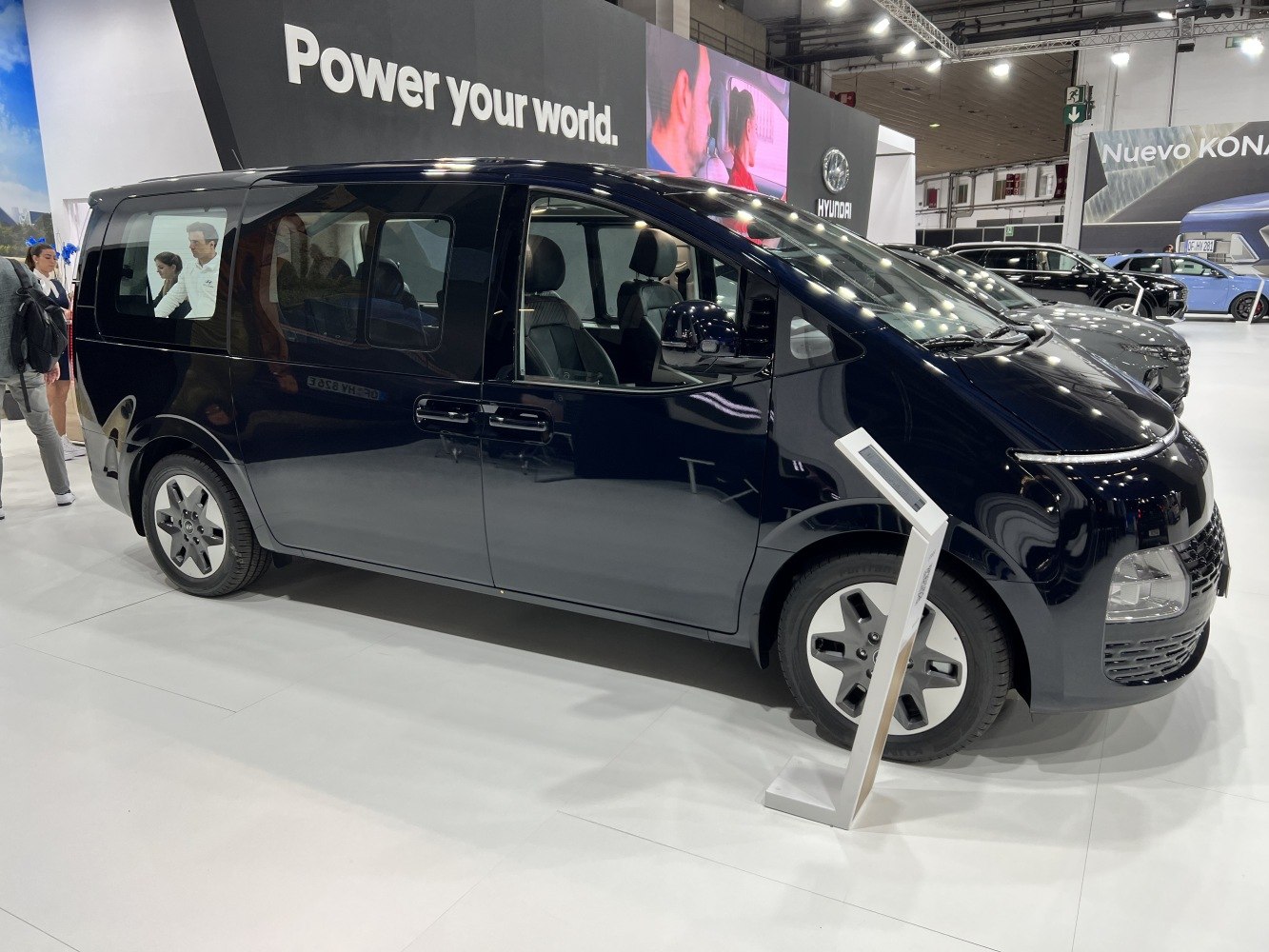 Modern multi-purpose van with large panoramic windows and sleek black body