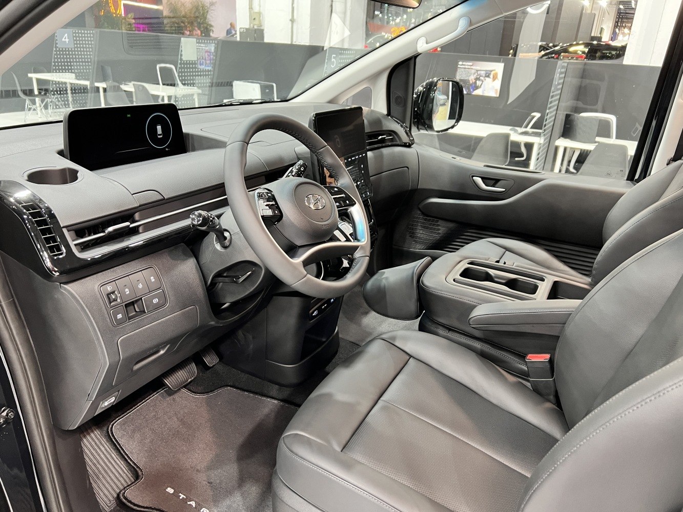 Modern dashboard and multifunction steering wheel in spacious vehicle interior