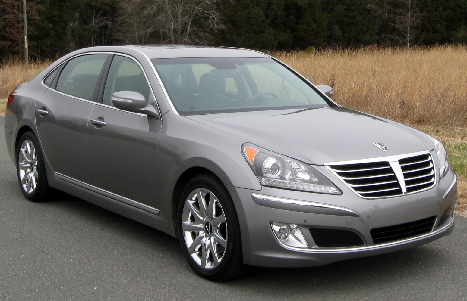 Luxury sedan with chrome wheels and bold front grille