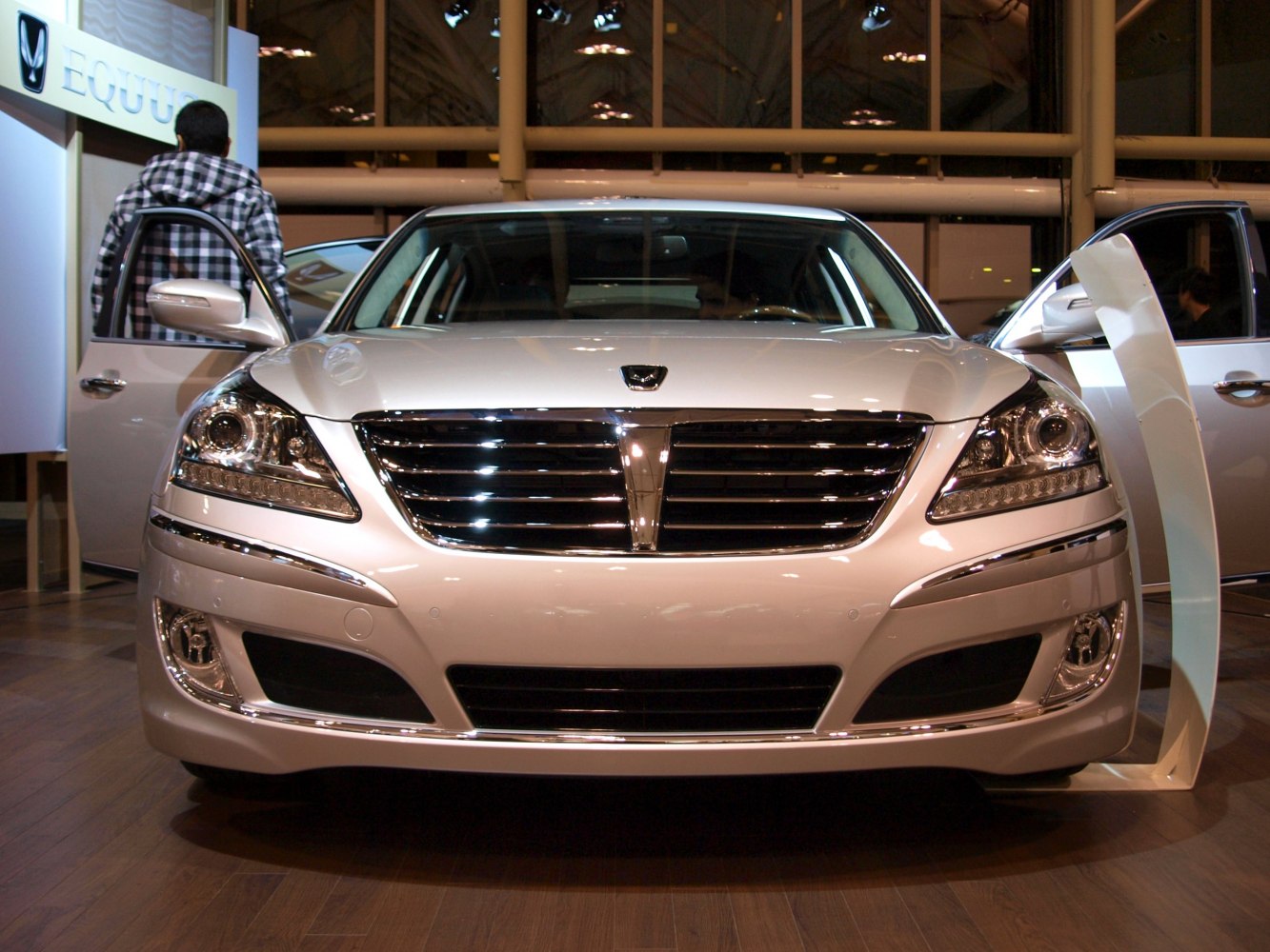 Front view featuring chrome grille and modern headlights on a luxury sedan.
