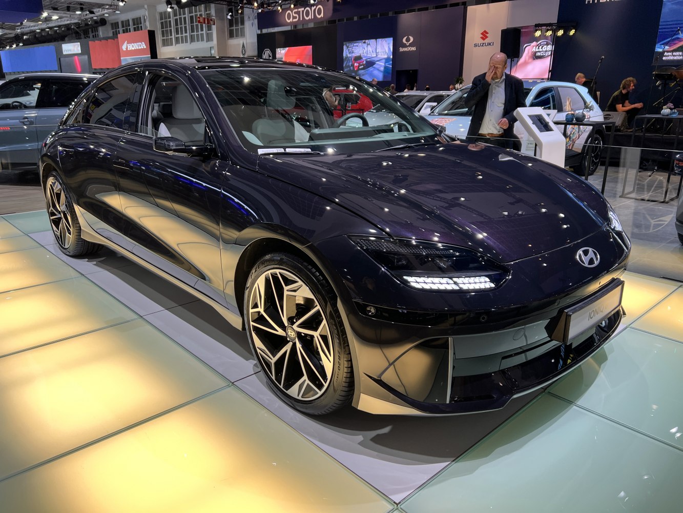Sleek electric sedan with futuristic LED headlights and aerodynamic design