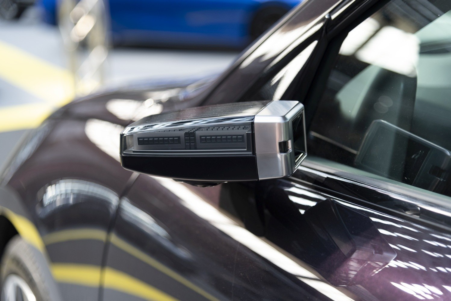 Close-up of side mirror with integrated LED turn signals