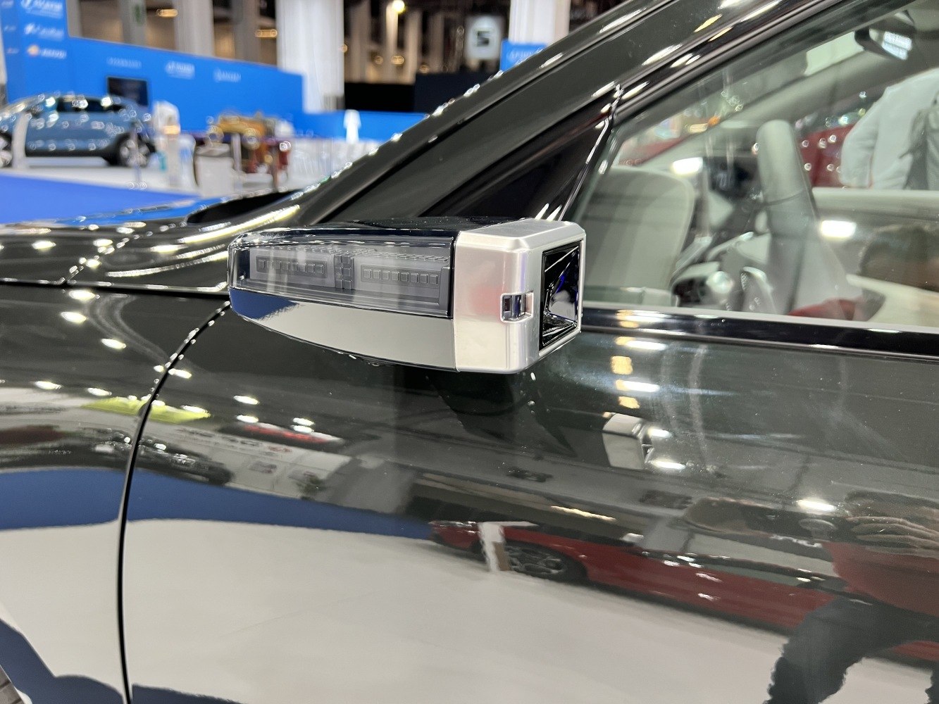 Close-up of futuristic digital side mirror on a vehicle