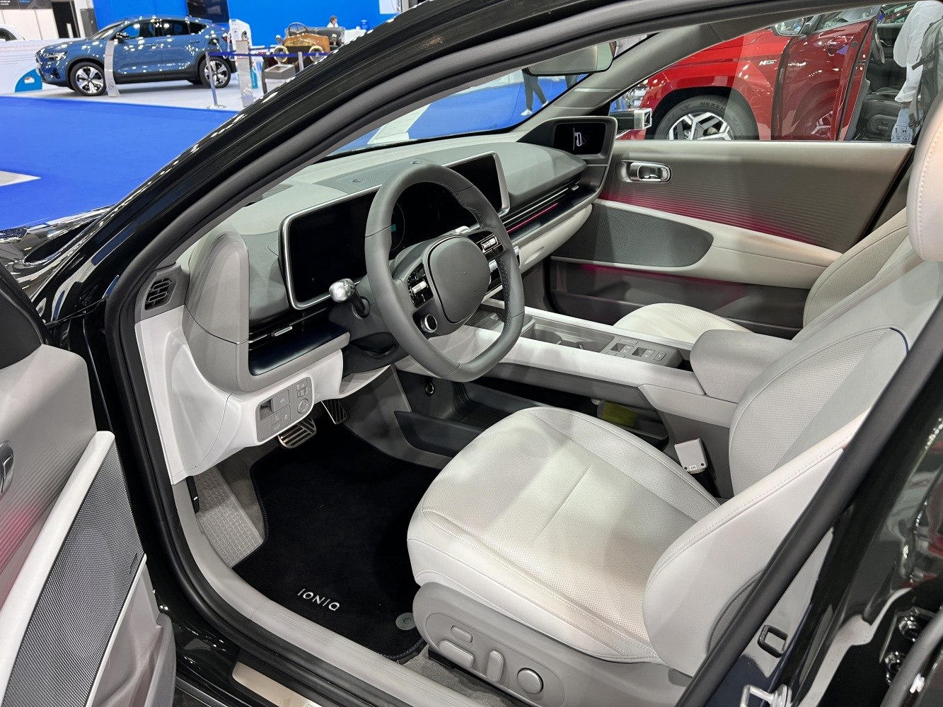 Sleek modern car interior with digital dashboard and premium front seats