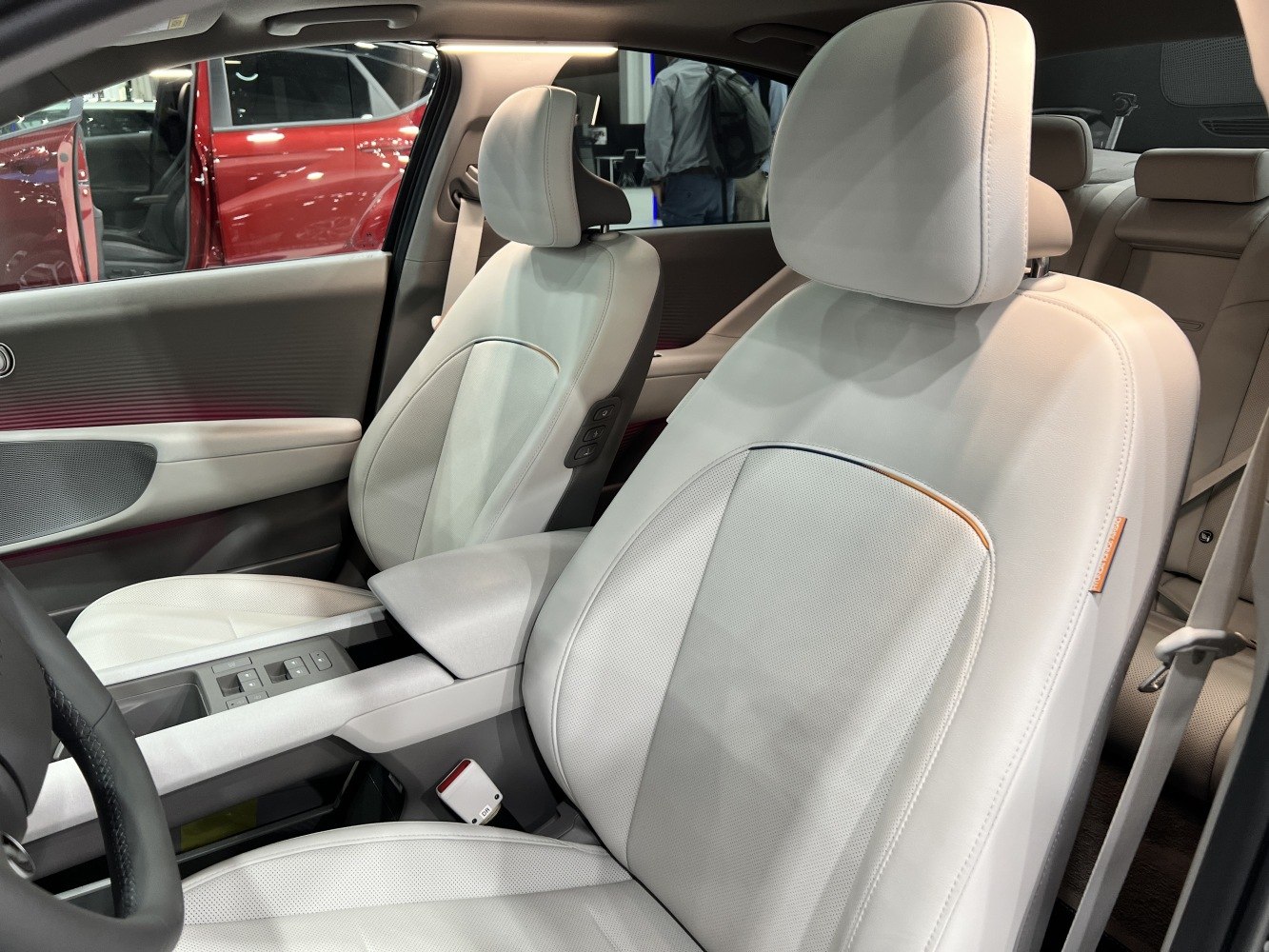 White leather front seats with detailed design and controls