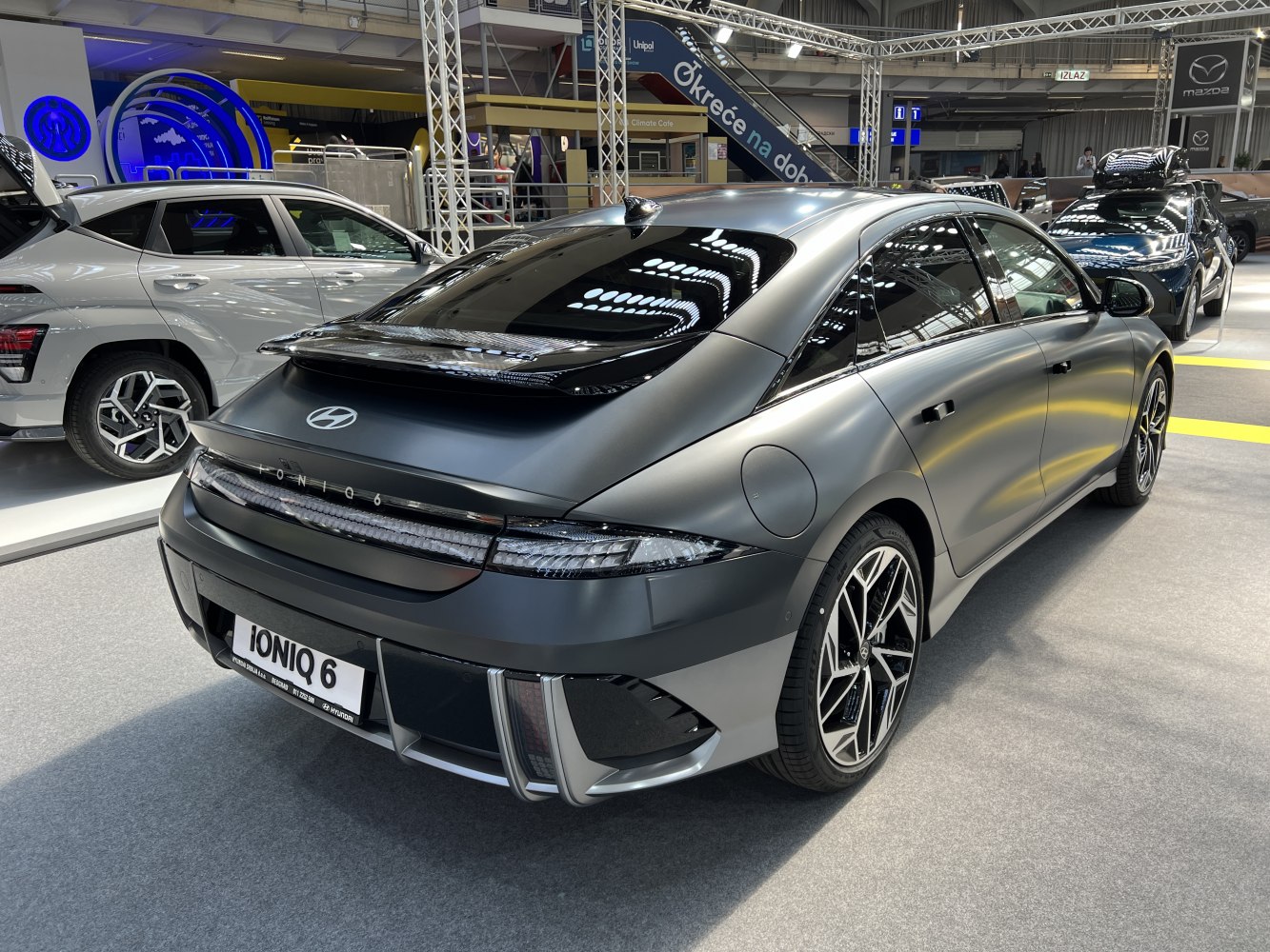 Sleek rear and side profile with aerodynamic design and alloy wheels