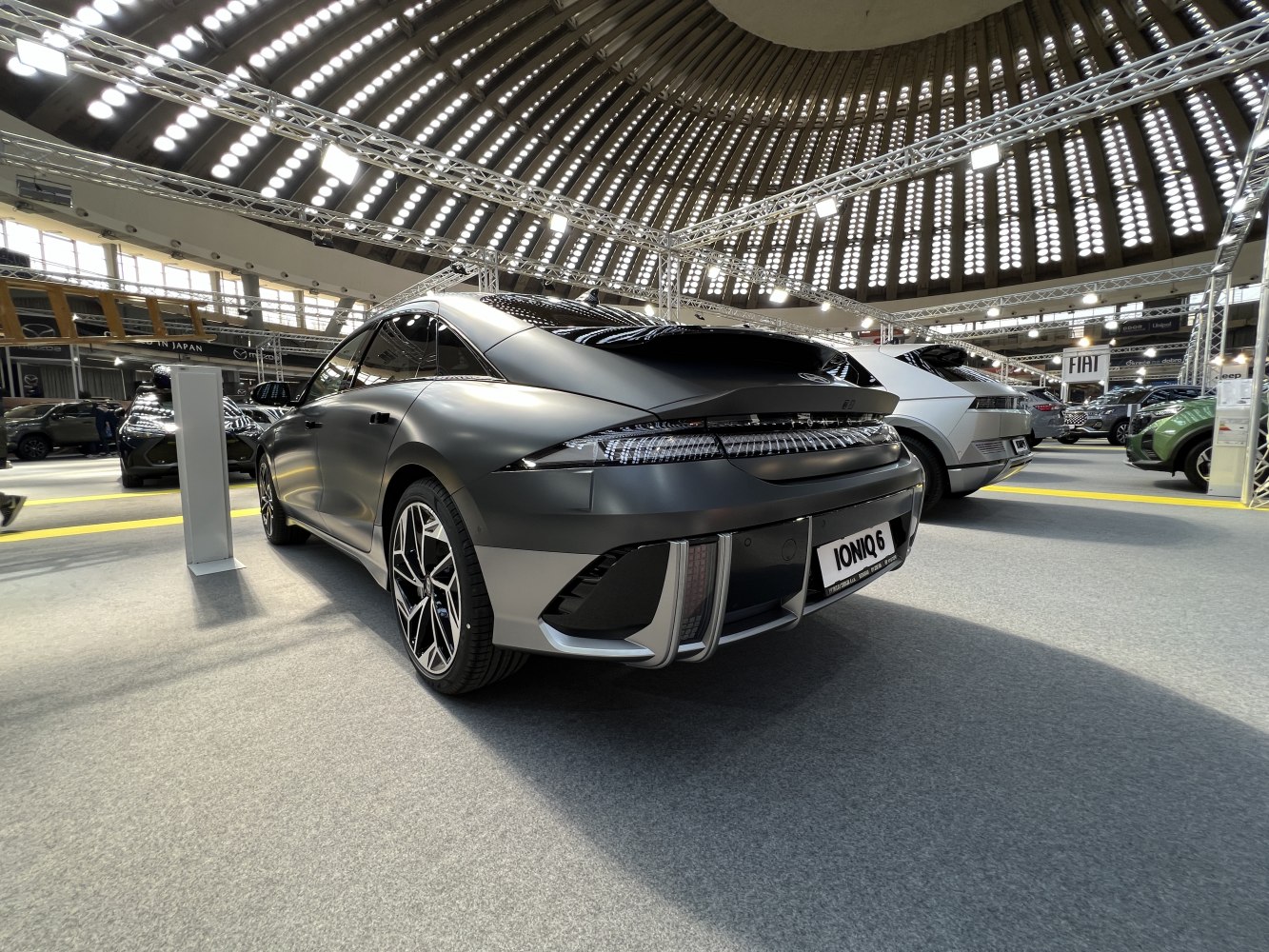 Rear view of electric hatchback with sleek taillights and aerodynamic design.