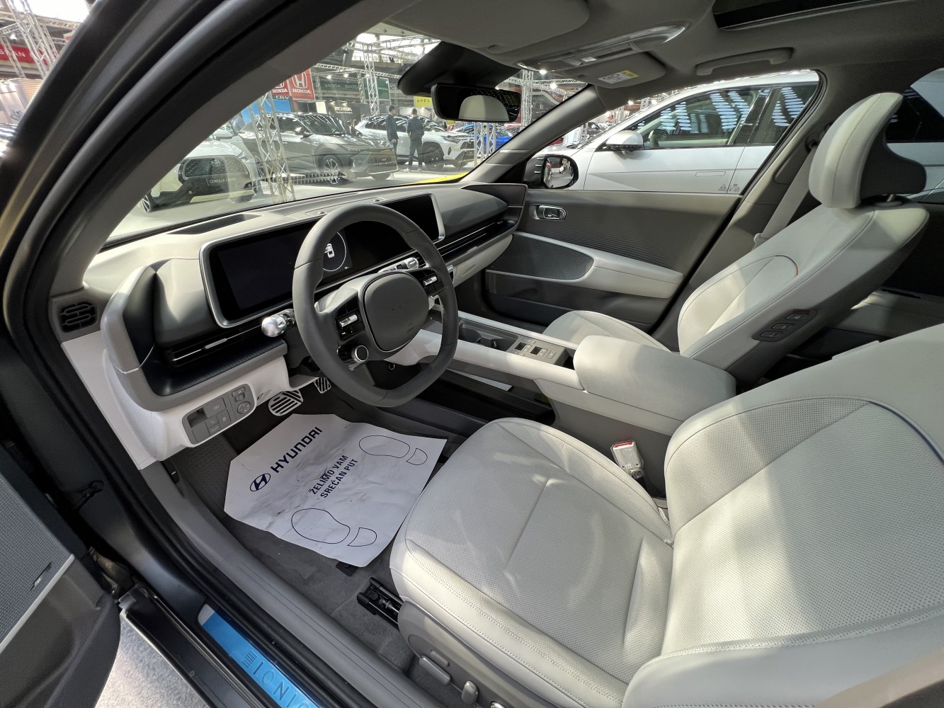 Modern car interior with digital dashboard and front seats