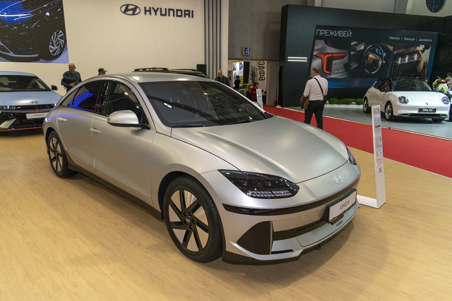 Sleek electric sedan front side with aerodynamic design and LED headlights