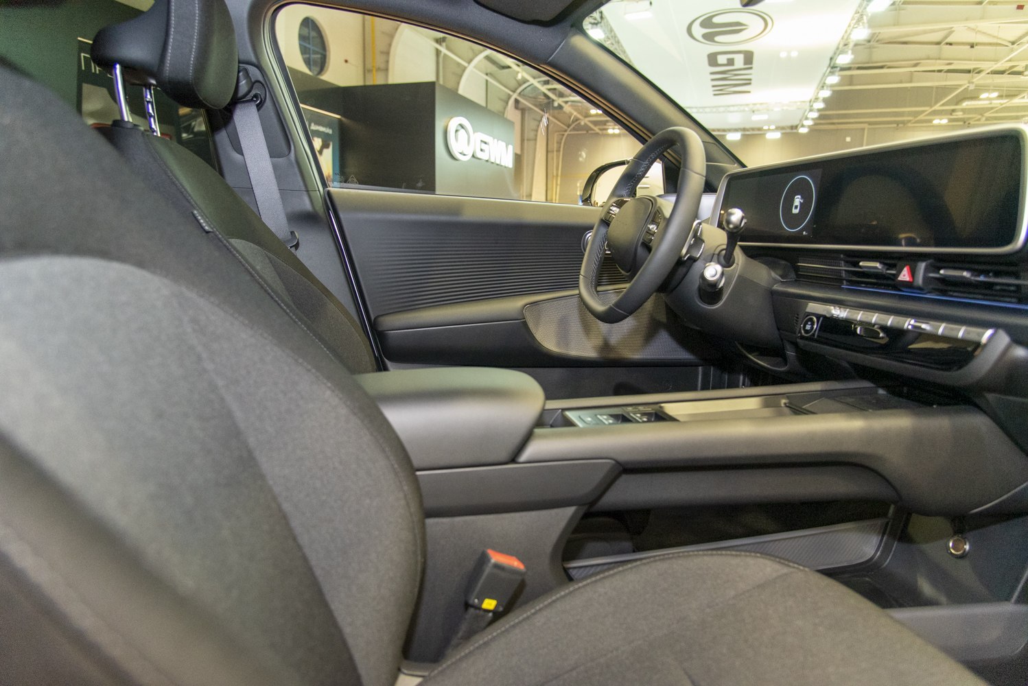 Modern car interior with digital dashboard and steering wheel