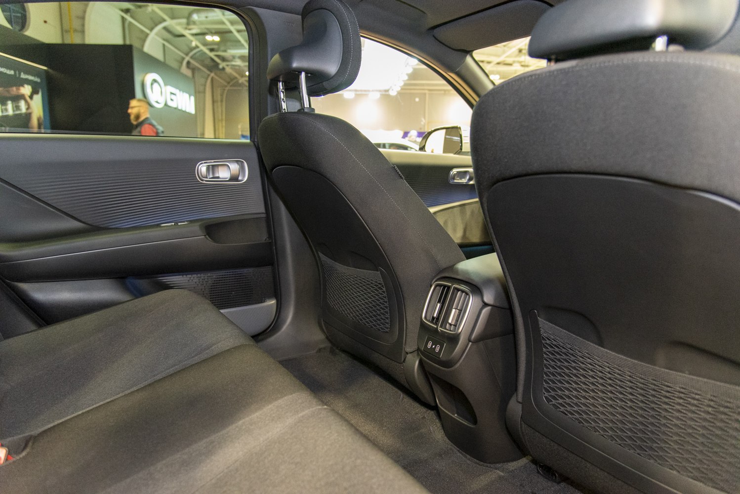 Rear seating area with air vents and storage pockets