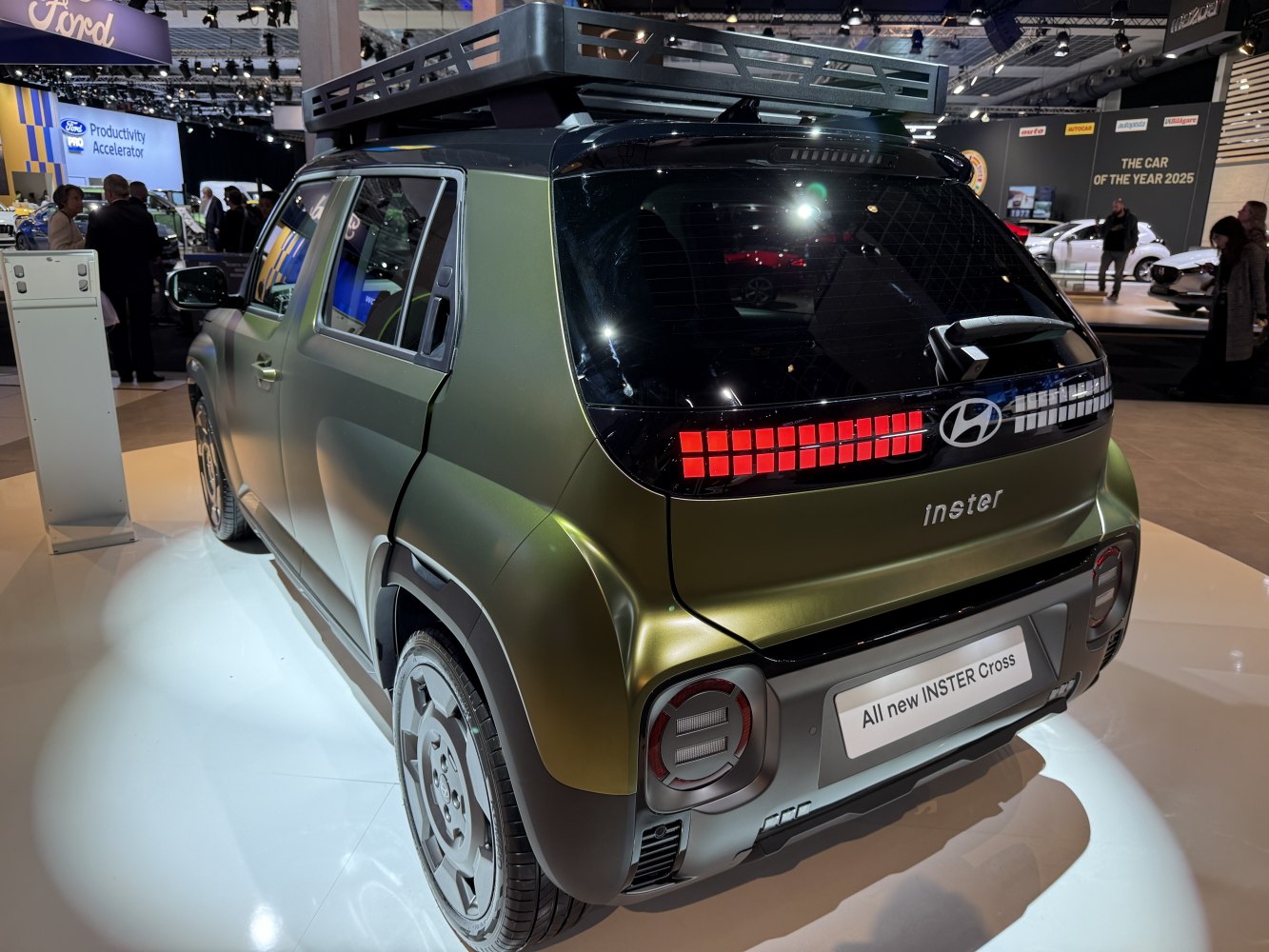 Rear view with LED tail lights and roof rack on green SUV