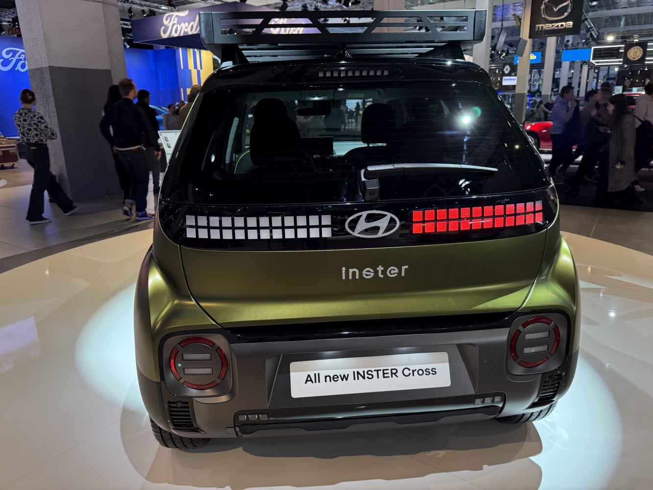 Rear view with pixel-style taillights and compact hatchback design