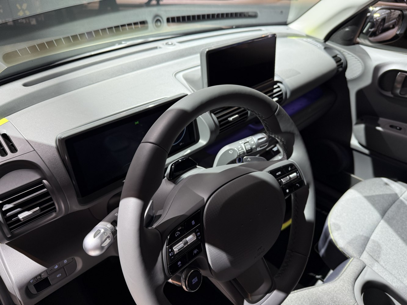 Digital dashboard with multifunction steering wheel and infotainment screen.