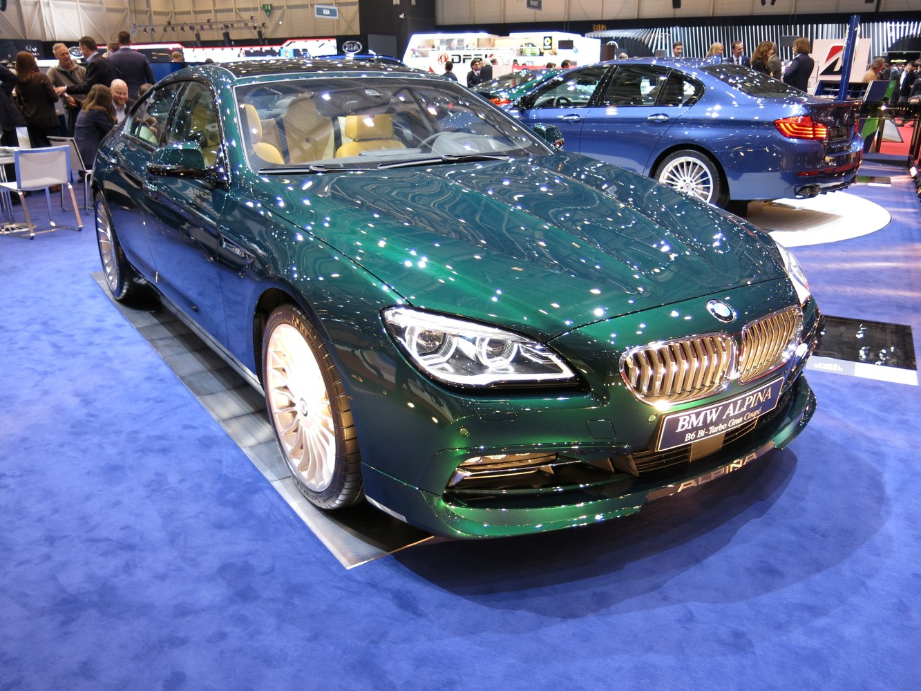 Luxury green gran coupe with LED headlights and signature front grille