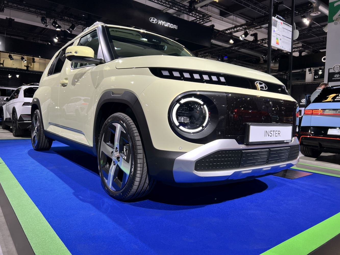 Circular LED headlights and squared grille on vehicle front