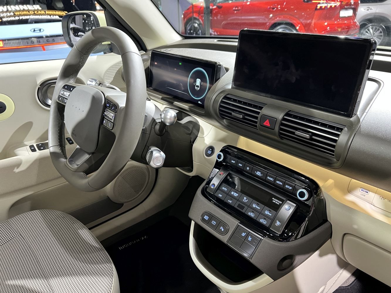 Dual digital displays and modern dashboard controls in car interior