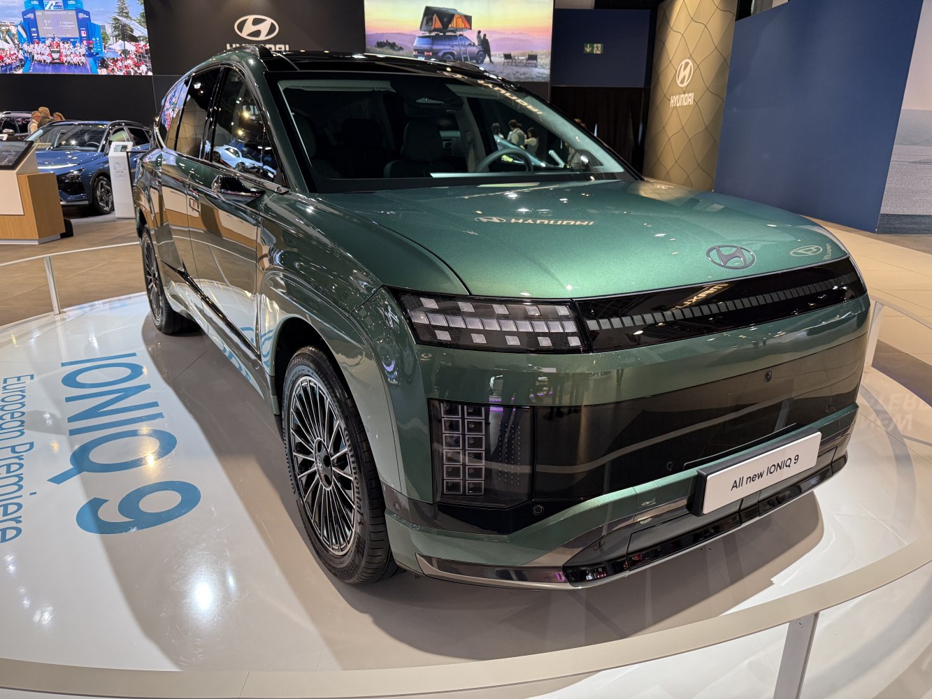 Futuristic front design with unique LED headlights and sleek body lines.