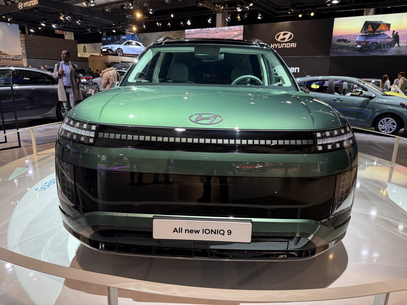 Front view of a modern electric SUV with pixel LED lighting.