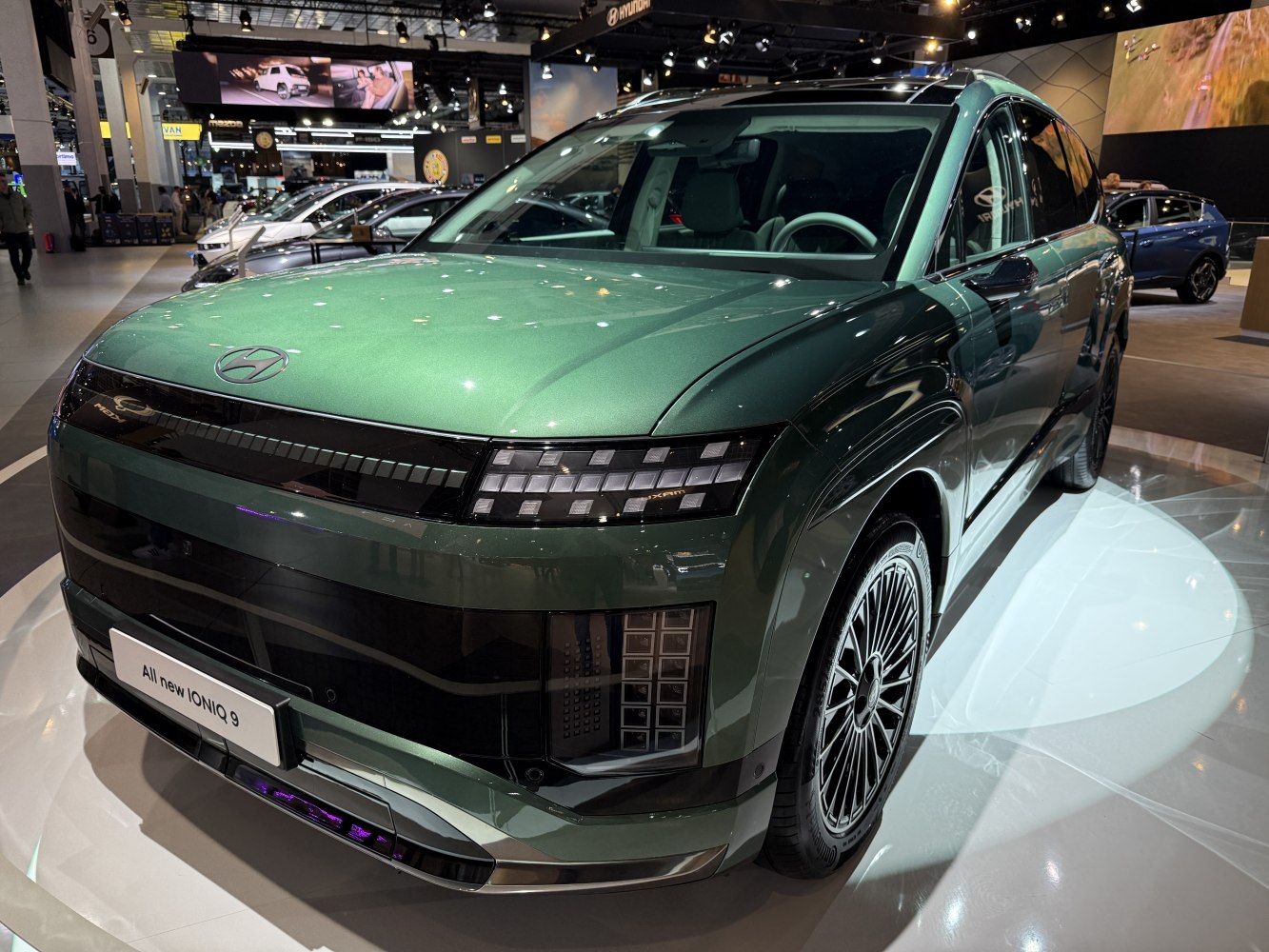 Front view of futuristic SUV with distinctive LED headlights and aerodynamic design