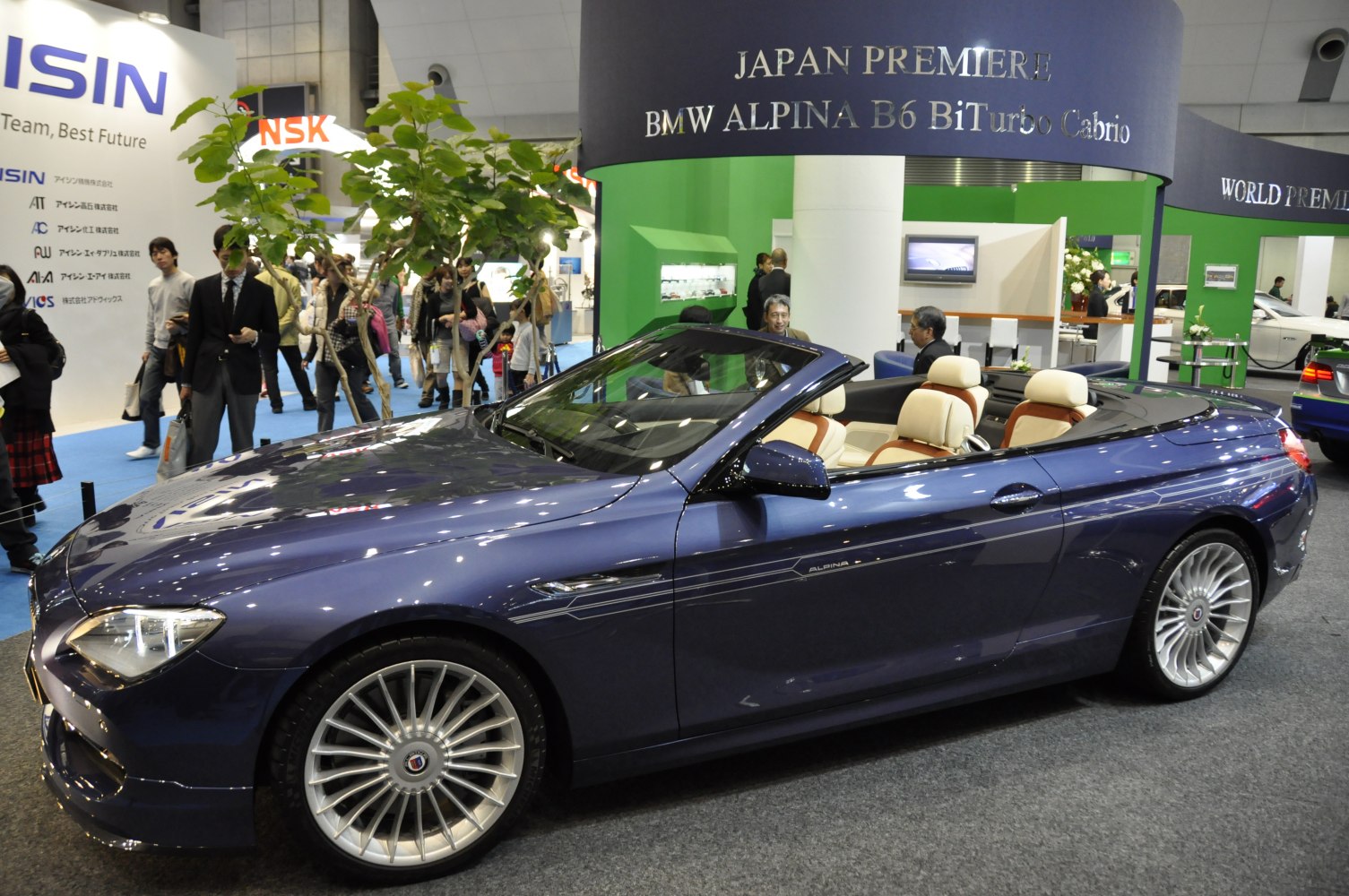 Convertible luxury sports coupe with multi-spoke wheels and two-tone leather seats
