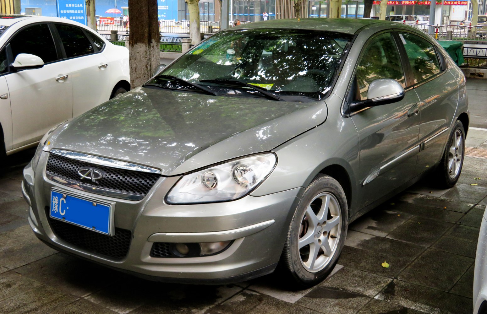 Front three-quarter view of hatchback with distinct headlights and grille