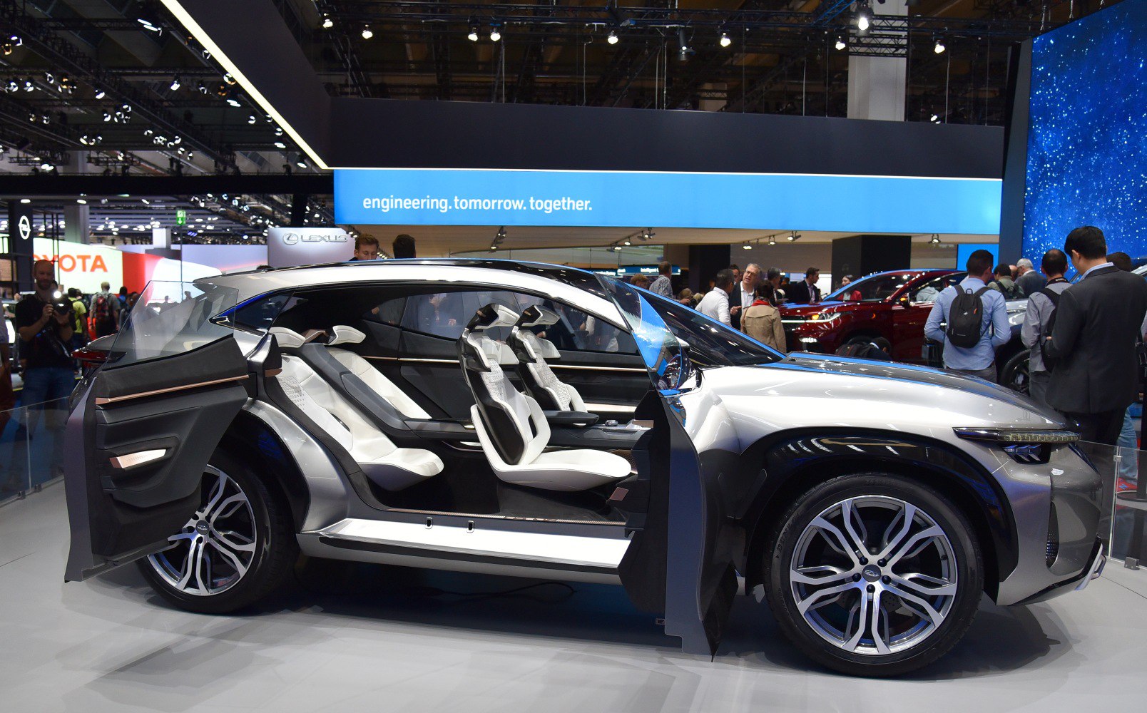 Futuristic SUV concept with front and rear-hinged doors and minimalist seats.