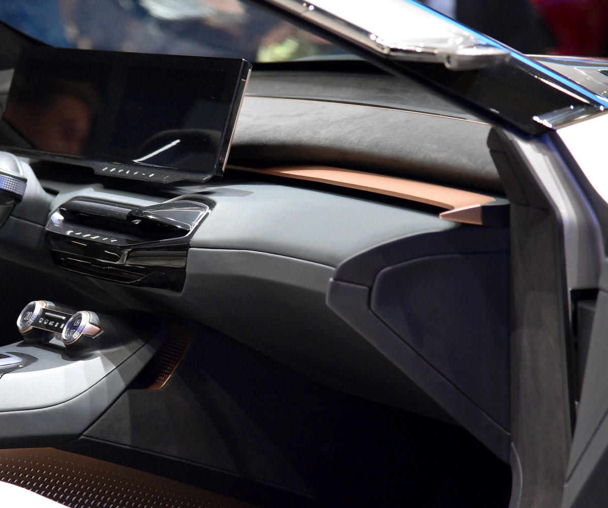 Modern dashboard with digital display and climate control knobs