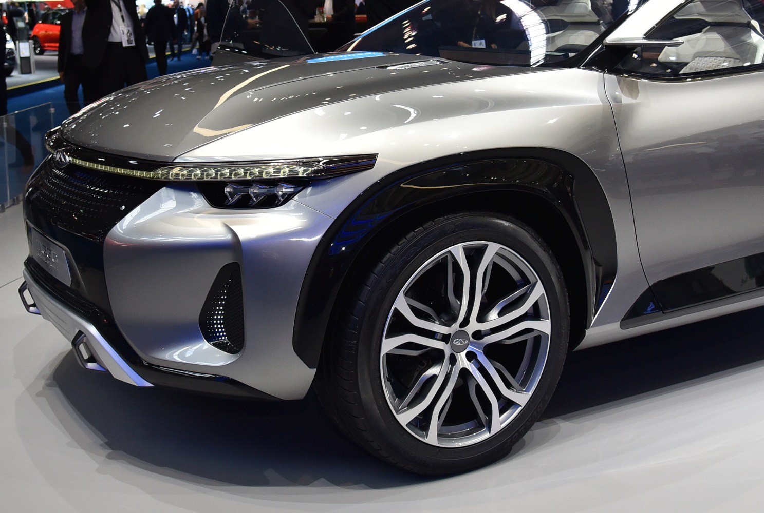 Front end and wheel design with futuristic headlights and distinctive grille.