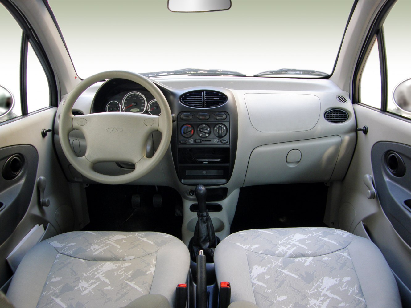 Interior dashboard with steering wheel and manual gear shift