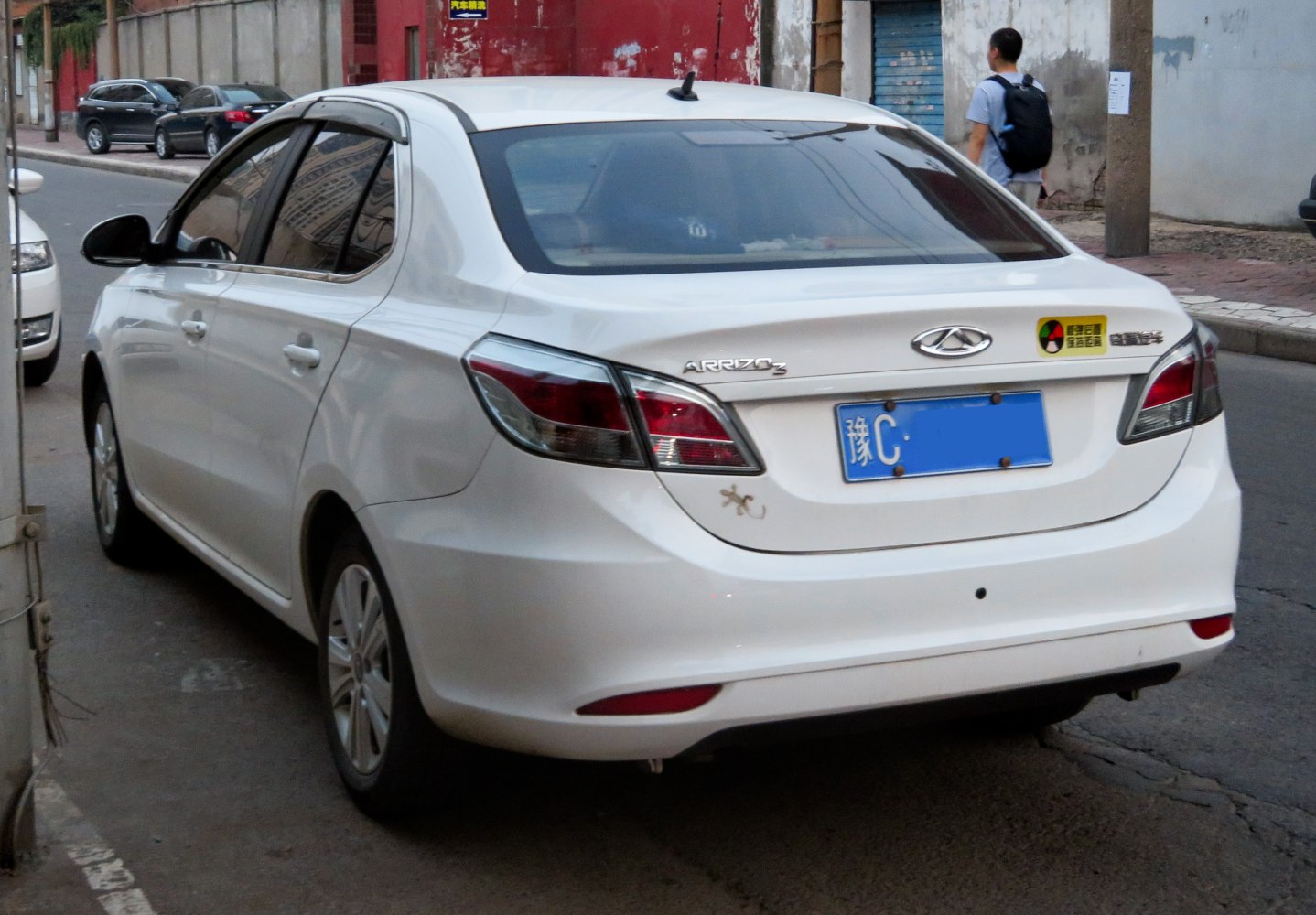 Rear view of sedan with distinct tail lights and bumper design