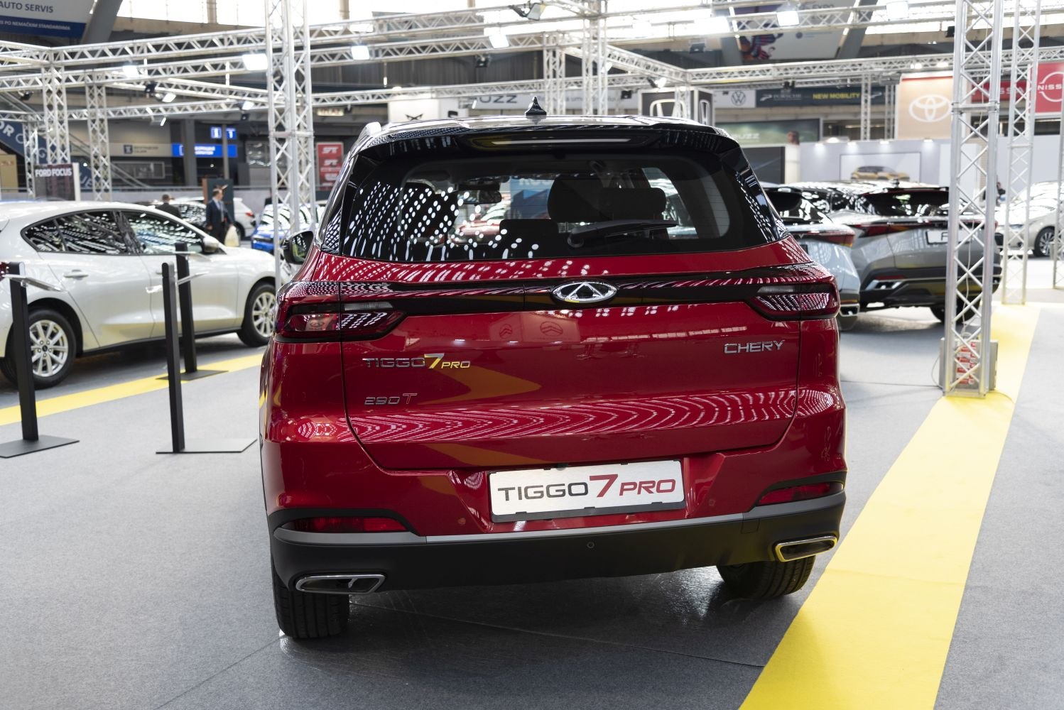 Rear view of red SUV with distinctive taillights and dual exhaust tips