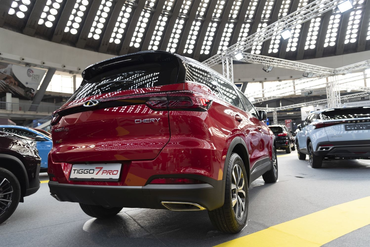 Rear view of red SUV with dual exhaust and LED tail lights