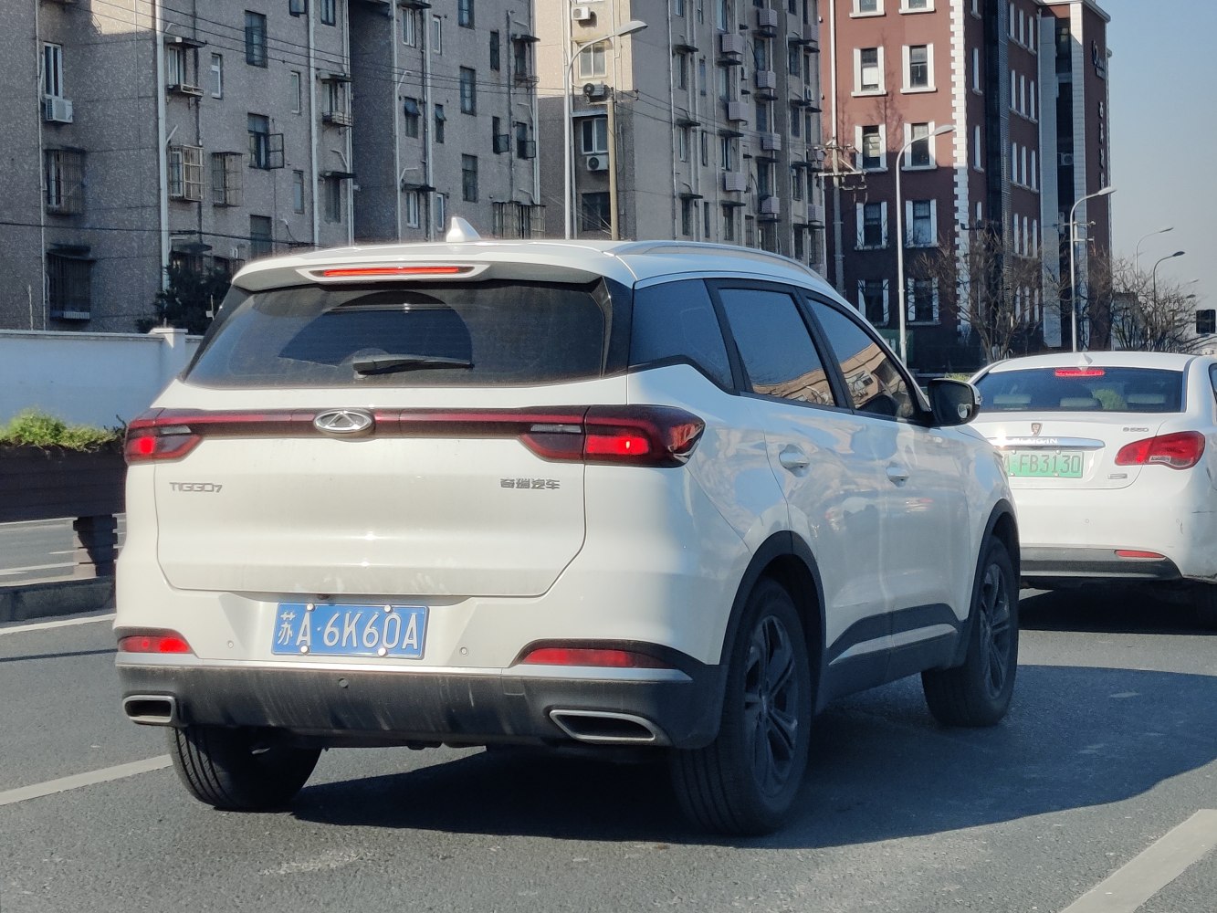 SUV rear with LED tail lights and dual exhausts