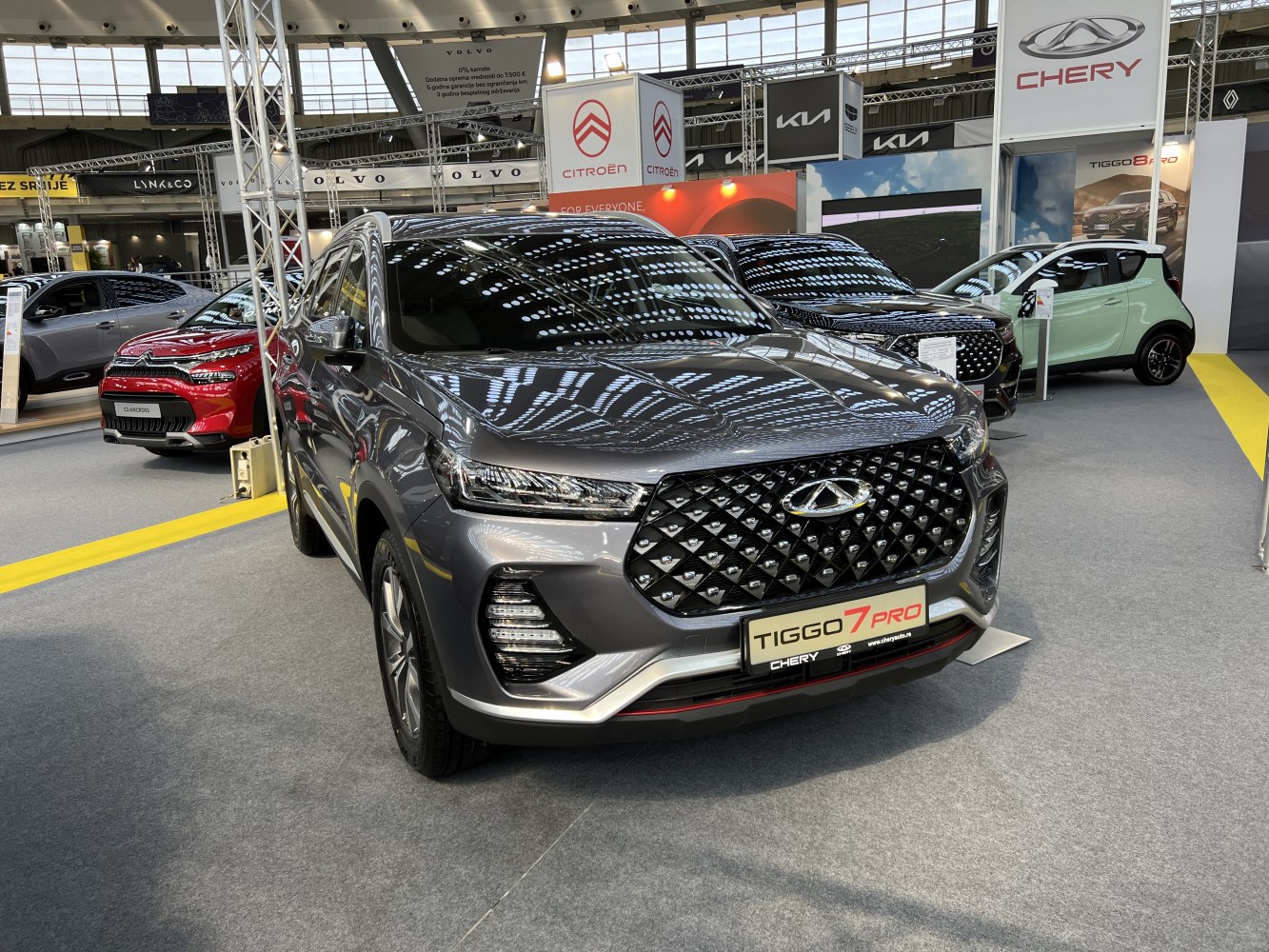 Front view with diamond-pattern grille and LED headlights