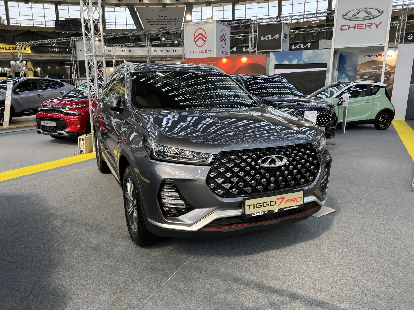 Front view of an SUV with diamond mesh grille and sleek headlights