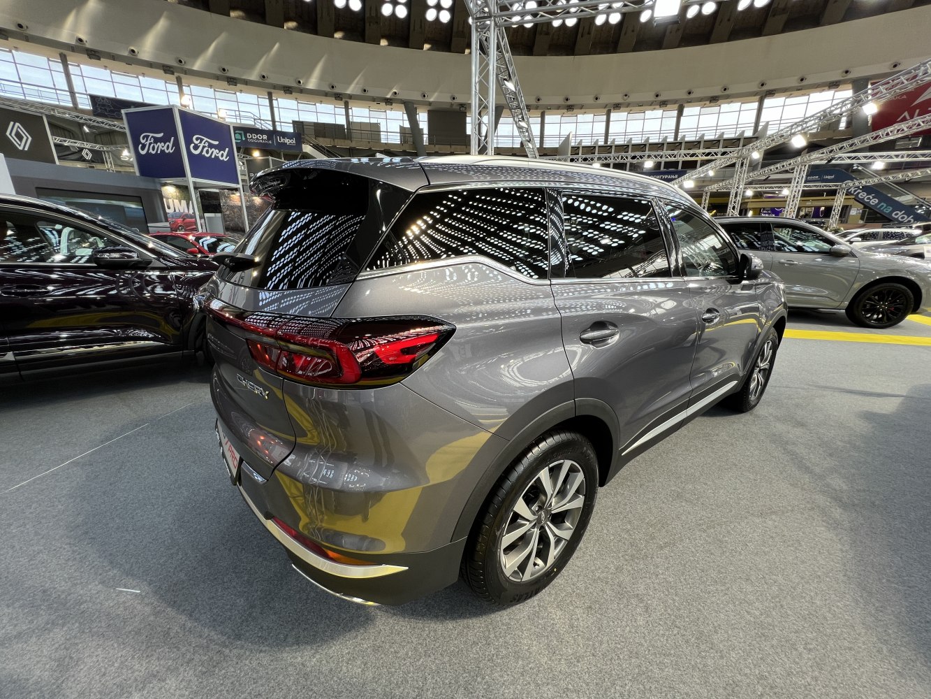 Rear side view of a modern SUV with sleek taillights and alloy wheels