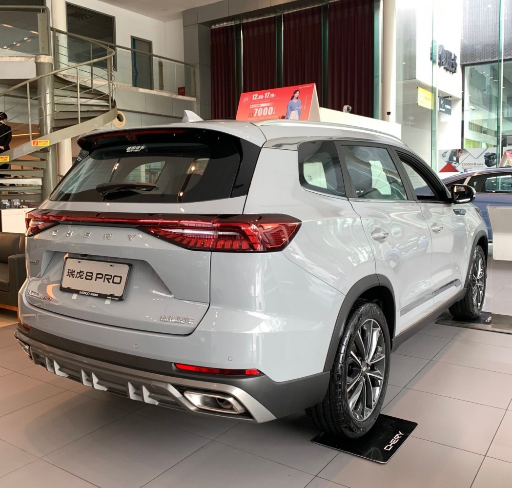 Rear view of an SUV with modern tail lights and dual exhausts