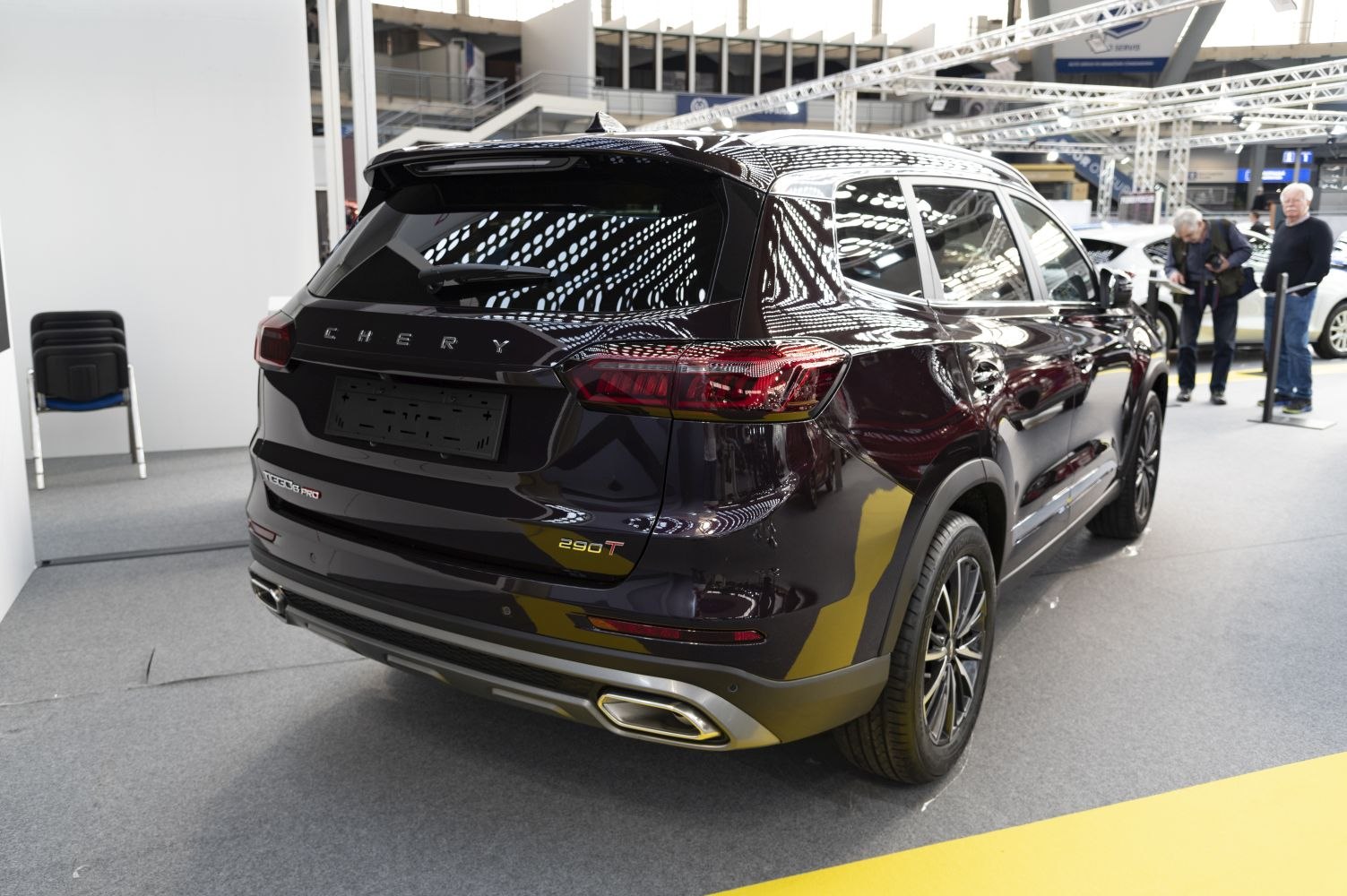 Rear view with distinctive taillights and dual integrated exhausts